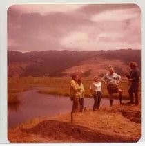 Photographs of Bolinas Bay. Aubrey Neasham talking to visitors to dig site