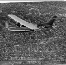 Dr. Alvin Marks, pilot and owner of Skymark Airlines. Here, his plane, Semper Fly III, in the air over the Sacramento River