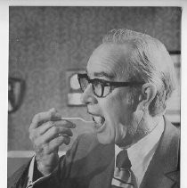 Here, Mayor Marriott samples a cake commemorating the city's 133rd birthday