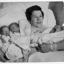 Mrs. Richard Goodnow, 19, of Yuba City, Sutter County, holds her triplets, sons Bruce, left, and Brad, and daughter Brenda, right, born yesterday