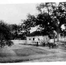 Ide Adobe with unidentified persons and horse-drawn cart