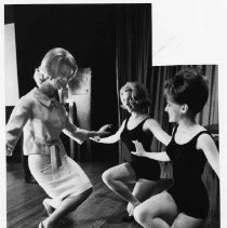 Yvonne Zetz, , left, the Miss the 1964 Miss Sacramento,teaches Vickie Brewer, center, and Lynn Steinver how to curtsy before the audience and judges