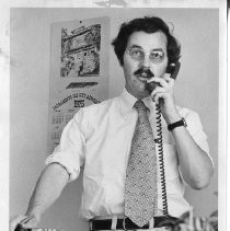 Phillip Isenberg, Sacramento City Councilman, Mayor, Assemblymember. He was running for Mayor when this photo was taken and is shown talking on the phone