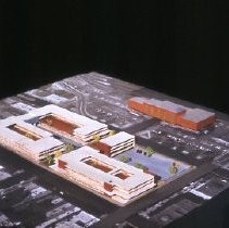 Views of redevelopment sites, renderings, and table models for the proposed Redevelopment District. Includes maps and site plans. This view shows a table model