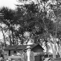 Woman in front of automobile