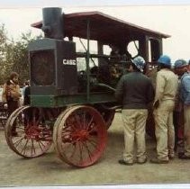 Photographs from Sacramento History Museum Groundbreaking. Workmen examining antique Case tractor