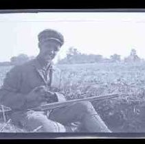 Men sitting in a field