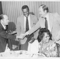 Hubert Humphrey, longtime U.S. Senator from Minnesota, 38th Vice President (under LBJ, 1965-1969), Democratic nominee for President, 1968. He shakes hands with an unidentified man in photo with another man and woman