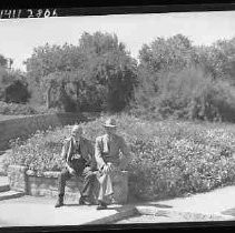 Two men sitting in a park