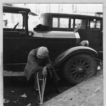 Dejected man with crutches