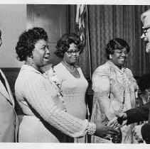 Callie Carney council member greets wellwisher during a reception held in her honor. Also shown is her husband James, her sister Willie-Mae Lash, and her mother Rosa Culpeper