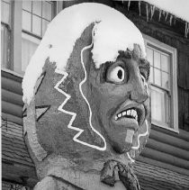 Wood Carved Figure in Snow