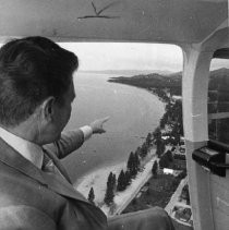 Man in Helicopter Points to Pollution Problems at Lake Tahoe