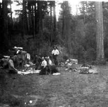 A group of six men preparing to have a meal