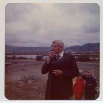 Photographs of landscape of Bolinas Bay. Man speaking to group gathered for a ceremony