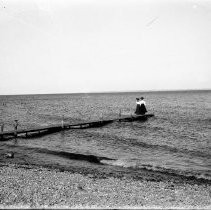 Two women at an ocean or lake beach