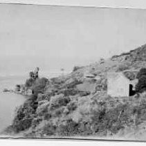 "Requa, "Rekwoi" on side hill above mouth of Klamath, taken about '40. House built after whites came."