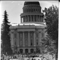 Mob in front of State Capitol, 11th and L Streets. President Lyndon B. Johnson, on a campaign visit to Sacramento, is shown by arrow