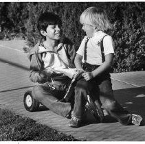 Nguyen Quoc Viet (left) gets a taste of all-American kids' play with his cousin Jamie Cooke. Nguyen is the grandson of Richard and Ruth Everton