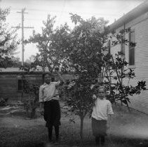 Portrait of a two boys near trees
