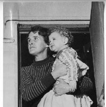 Woman, Child and Dog Look at Flood Waters