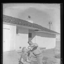 A man and a woman on a patio