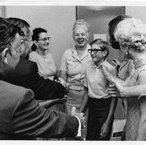 Dr. Irene Hickman, the Sacramento County Assessor, with her son Alan (13), is greeted by members of her staff after voters rejected a recall movement against her