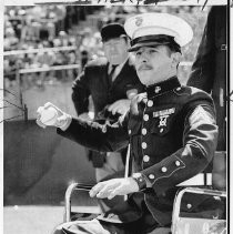 Marine Cpl. Brian W. Egger, throws out the first ball at an Oakland A's game