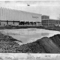 Lake of water from broken later line, with Macy's in background