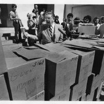 Howard Jarvis, businessman, lobbyist and anti-tax advocate behind Proposition 13, shown here with boxes of letters supporting Prop 13 at a Capitol news conference