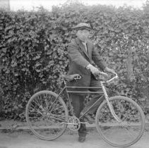 Young man with bicyle