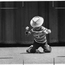 SERIES: Four views of "Andy Brein of San Jose, CA displaying his frog starting technique in Calaveras County's annual jubilee and his entry responds with a pretty fair country leap" at the Calaveras County Frog Jump