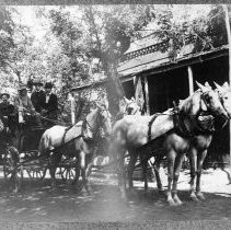 Horse-drawn wagon with unidentified men, probably in 1903 July Fourth celebration