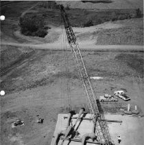 Alpha test stands. Hoisting diffuser ejector into position on Test Stand 1