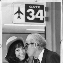 Camelllia Queen Linda Lifur being kissed goodbye by Mayor Richard Marriott at the airport