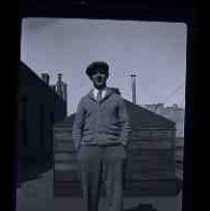 An young man standing on the roof of a building