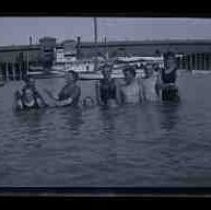 Young men swimming