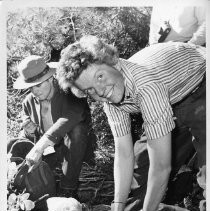 Ellen Searby, 24, fiancee of Warren Harding, who led the first team to conquer El Capitan, packs gear and food. At left, Ranger Rick Anderson