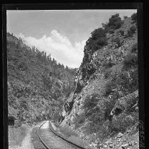 Railroad track through a mountain cut