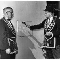 Scottish Rites Temple cornerstone being tapped into place