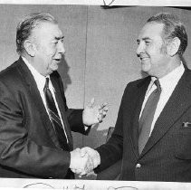 Dr. Earl Klapstein, Chancellor of Los Rios Community College District (right), shaking hands with the interim chancellor, Elwood J. Keema