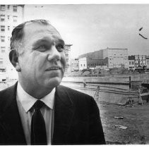 Ralph L. Herod, Executive Director of the Redevelopment Agency of the City of Sacramento, looking at progress at a project in the city's West End