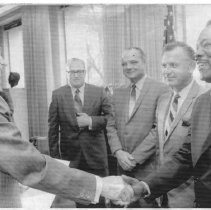Caption reads: "Gov. Ronald Reagan talks with new members of the State Real Estate Board after swearing them in."