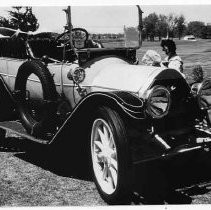 View of an antique car on display at a golf course