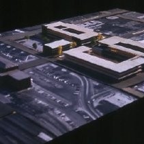 Views of redevelopment sites, renderings, and table models for the proposed Redevelopment District. Includes maps and site plans. This view shows a table model