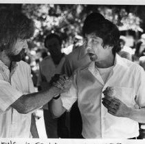 Tom Hayden (Thomas E. Hayden), antiwar and civil rights activist, walking the K Street Mall, with ice cream cone. He was a candidate for U.S. Senator from California (Democratic primary)