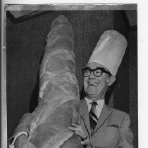 Richard H. Marriott, Mayor of Sacramento, 1968-1975. Here, Mayor Marriott laughingly staggers under the weight of a giant loaf of bread