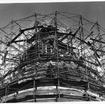 View of the California State Capitol restoration project with the dome shrouded in scaffolding and steel supports