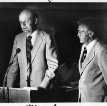 William Hegg (at mike), president of Sacramento Savings and Loan, presents Police Chief John Kearns a Secret Witness check for $906 at a City Council meeting