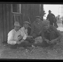 A hunting club posed with guns